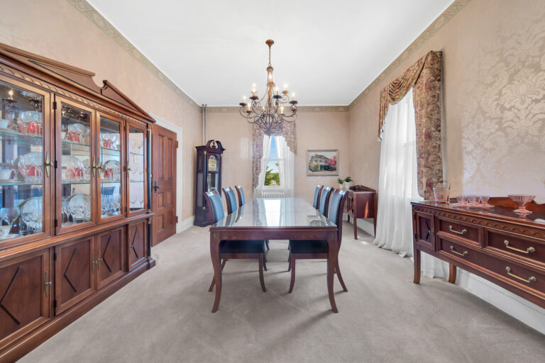 formal dining room with built in china cabinet and chandelier at 19 Occident Avenue in Stapleton Heights, Staten Island