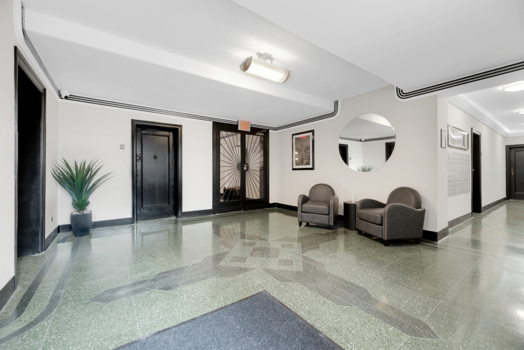Art deco lobby with terrazzo floor and original sunburst door at 8701 Shore Road prewar co-op Bay Ridge Brooklyn