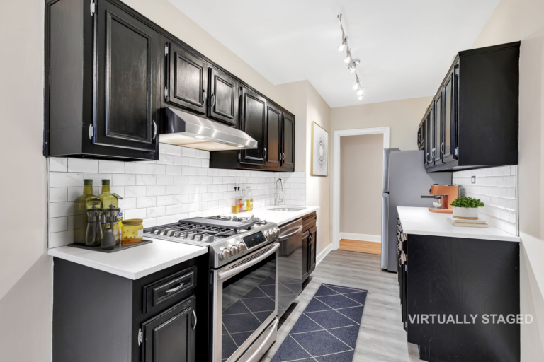 Galley kitchen with stainless range and subway tile from the reverse angle, 8701 Shore Road Apt 131 one bedroom co-op Bay Ridge Brooklyn
