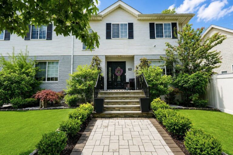 Front exterior and paved walkway of the house at 126 South Railroad Street, Staten Island