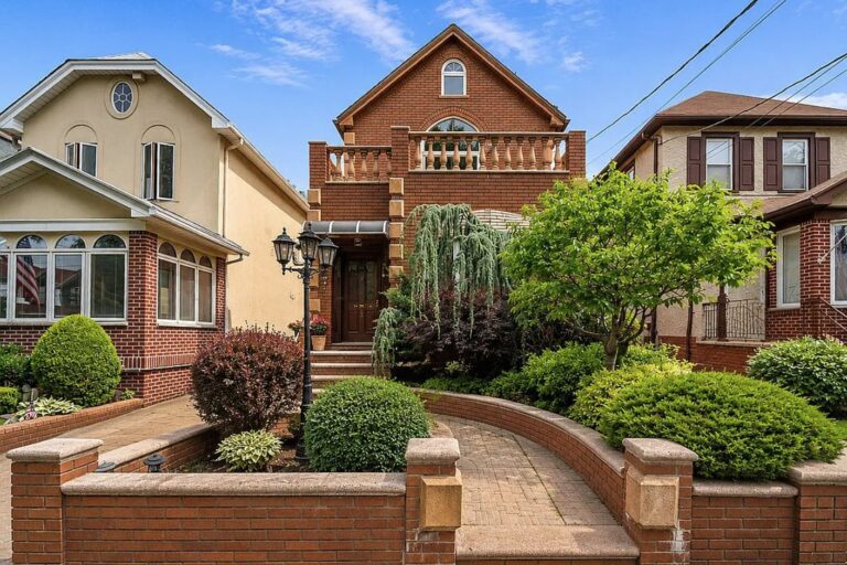 Brick single family house with a balustraded balcony and landscaped front garden at 173 79th Street in Bay Ridge, Brooklyn