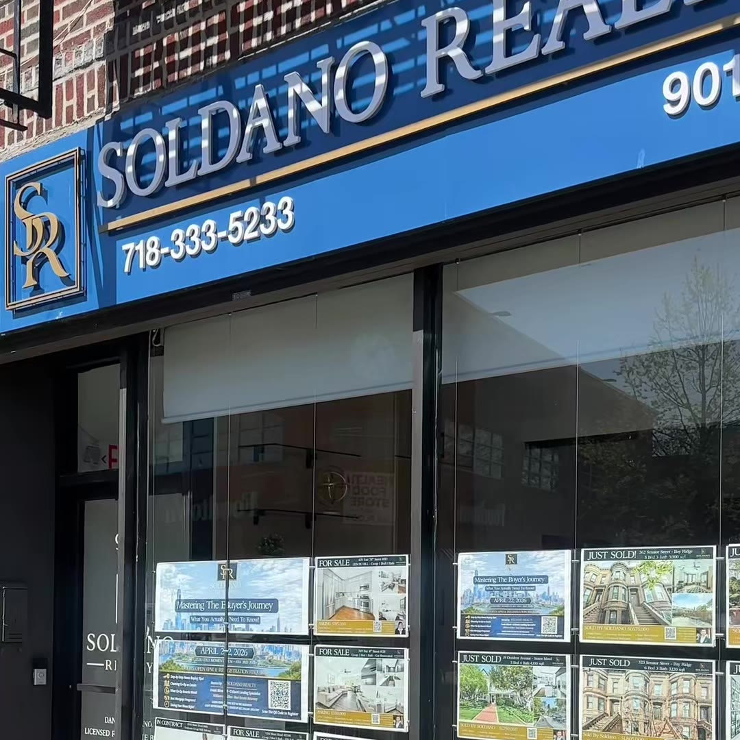 The Soldano Realty storefront at 9014 3rd Avenue in Bay Ridge, with current listings on display in the window