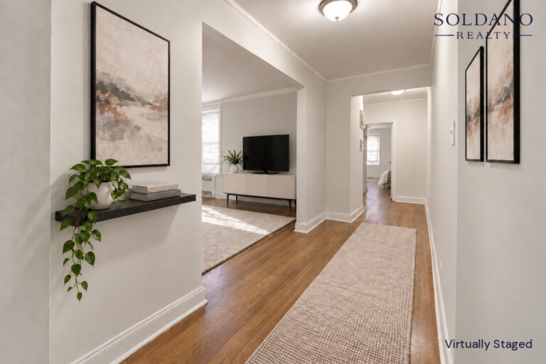 Hall leading from the foyer past the living room to the bedroom at 9281 Shore Road Apt 122 in Bay Ridge, Brooklyn