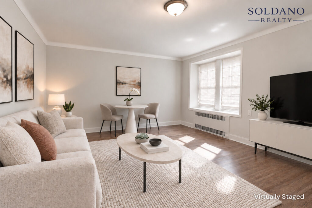 Living room with a pair of windows in a deep window bay and crown moulding at 9281 Shore Road Apt 122 in Bay Ridge, Brooklyn