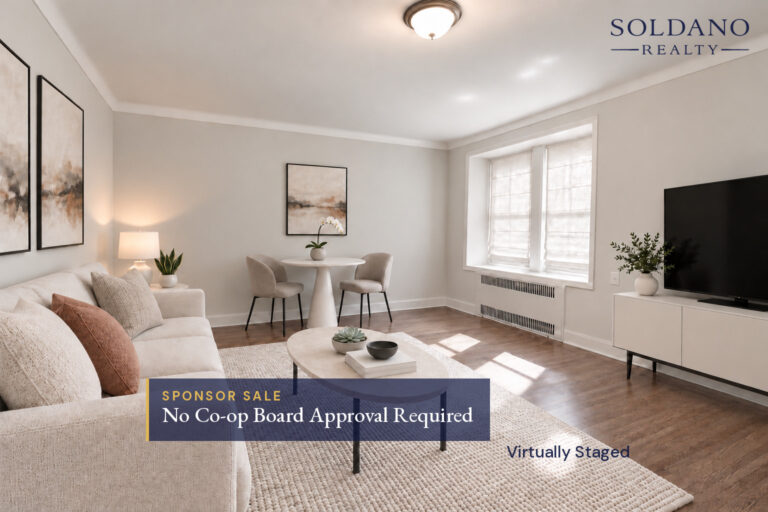 Living room with a pair of windows in a deep window bay and crown moulding at 9281 Shore Road Apt 122 in Bay Ridge, Brooklyn. Sponsor sale, no co-op board approval required.