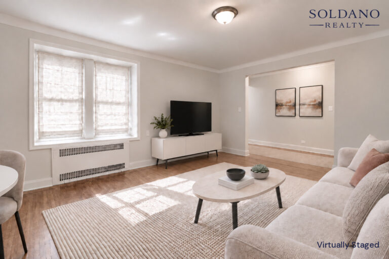 Living room looking toward the wide opening to the hall at 9281 Shore Road Apt 122 in Bay Ridge, Brooklyn